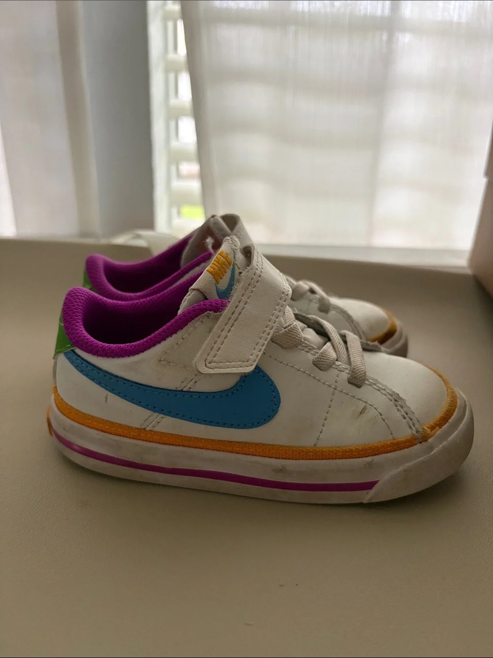 Nike Kids White Sneakers with Blue Swoosh & Purple Lining